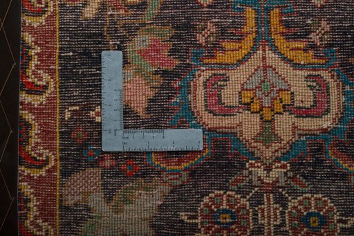 Backside of handmade 2000s Shiraz rug showing knot structure and weave density