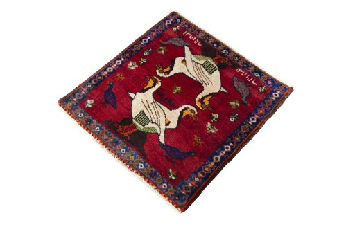 Corner detail of 2000s Shiraz rug showing border pattern and Wool pile