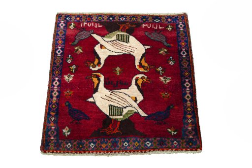 Surface texture of 2000s Shiraz rug with natural Wool and intricate pattern