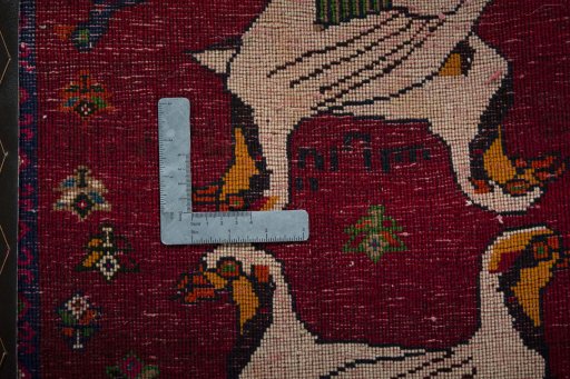 Backside of handmade 2000s Shiraz rug showing knot structure and weave density