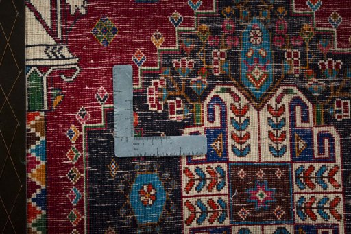 Backside of handmade 2000s Shiraz rug showing knot structure and weave density