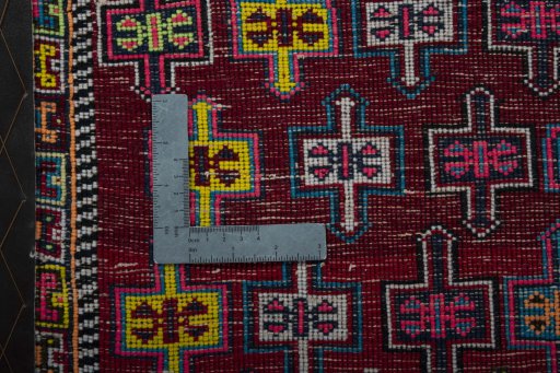 Backside of handmade 2000s Shiraz rug showing knot structure and weave density