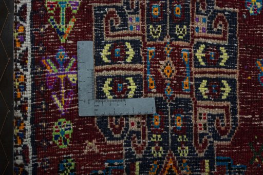 Backside of handmade 2000s Shiraz rug showing knot structure and weave density