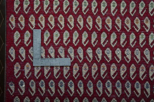 Backside of handmade 2000s Shiraz rug showing knot structure and weave density