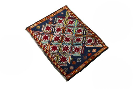 Corner detail of 2000s Shiraz rug showing border pattern and Wool pile