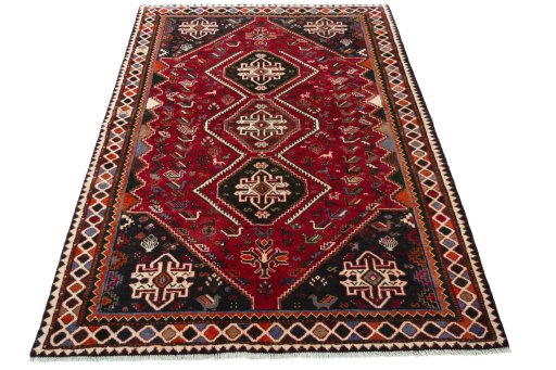 Surface texture of 2000s Shiraz rug with natural Wool and intricate pattern