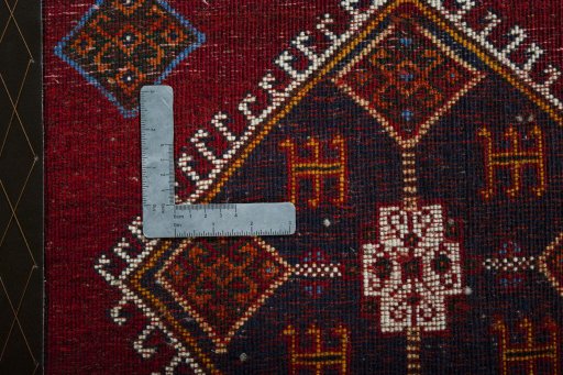 Backside of handmade 2000s Shiraz rug showing knot structure and weave density