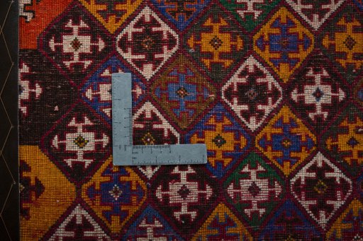 Backside of handmade 2000s Shiraz rug showing knot structure and weave density