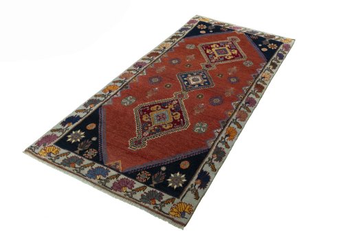 Corner detail of 2000s Shiraz rug showing border pattern and Wool pile