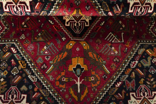 Corner detail of 2000s Shiraz rug showing border pattern and Wool pile