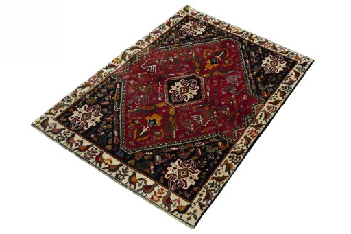 Corner detail of 2000s Shiraz rug showing border pattern and Wool pile