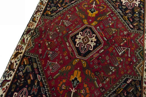 Backside of handmade 2000s Shiraz rug showing knot structure and weave density