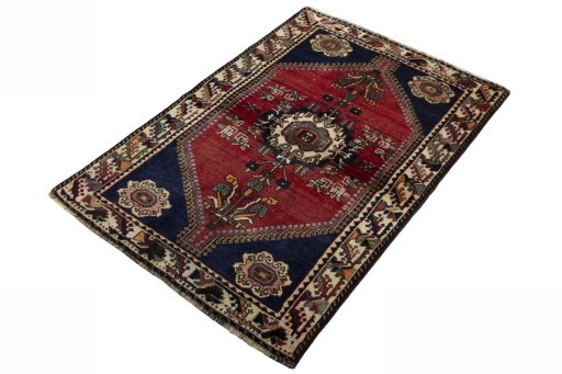 Corner detail of 2000s Shiraz rug showing border pattern and Wool pile