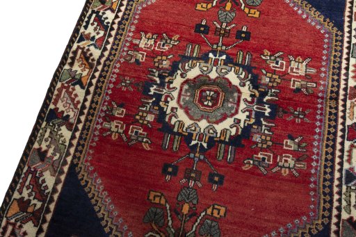 Backside of handmade 2000s Shiraz rug showing knot structure and weave density