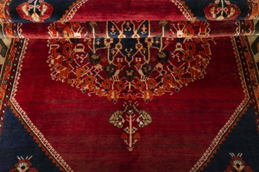 Corner detail of 2000s Shiraz rug showing border pattern and Wool pile