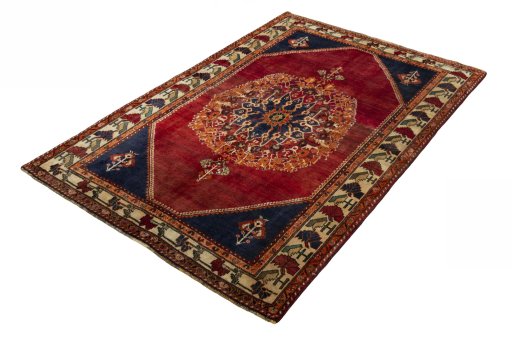 Corner detail of 2000s Shiraz rug showing border pattern and Wool pile