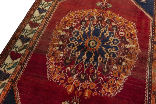 Backside of handmade 2000s Shiraz rug showing knot structure and weave density