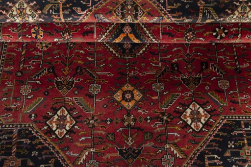 Corner detail of 2000s Shiraz rug showing border pattern and Wool pile