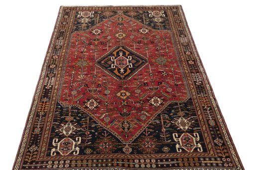 Surface texture of 2000s Shiraz rug with natural Wool and intricate pattern