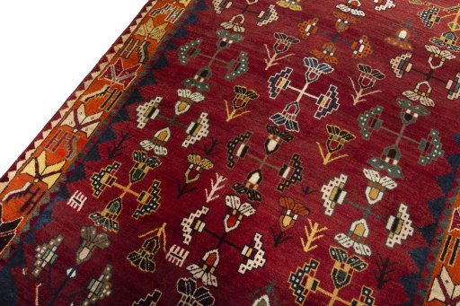 Backside of handmade 2000s Shiraz rug showing knot structure and weave density