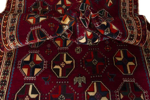 Corner detail of 2000s Shiraz rug showing border pattern and Wool pile