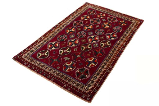 Corner detail of 2000s Shiraz rug showing border pattern and Wool pile