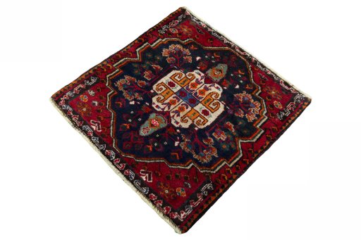 Corner detail of 2000s Shiraz rug showing border pattern and Wool pile