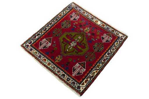 Corner detail of 2000s Shiraz rug showing border pattern and Wool pile
