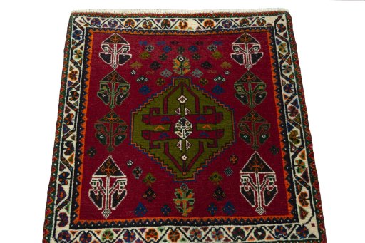 Surface texture of 2000s Shiraz rug with natural Wool and intricate pattern