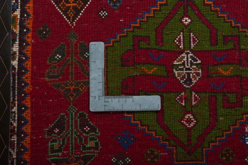 Backside of handmade 2000s Shiraz rug showing knot structure and weave density