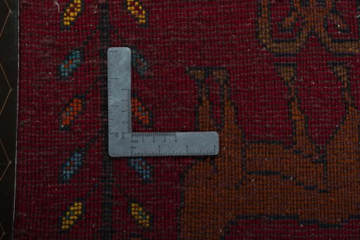Backside of handmade 2000s Shiraz rug showing knot structure and weave density