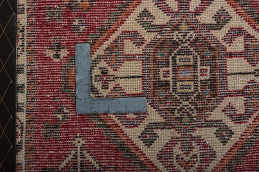 Backside of handmade 2000s Shiraz rug showing knot structure and weave density