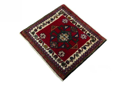 Corner detail of 2000s Shiraz rug showing border pattern and Wool pile