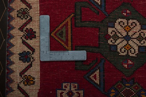 Backside of handmade 2000s Shiraz rug showing knot structure and weave density