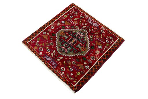 Corner detail of 2000s Shiraz rug showing border pattern and Wool pile