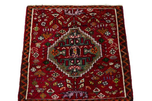 Surface texture of 2000s Shiraz rug with natural Wool and intricate pattern