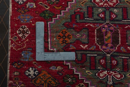 Backside of handmade 2000s Shiraz rug showing knot structure and weave density