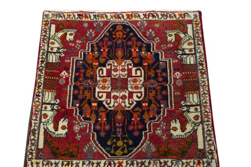 Surface texture of 2000s Shiraz rug with natural Wool and intricate pattern