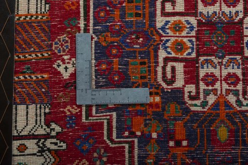 Backside of handmade 2000s Shiraz rug showing knot structure and weave density