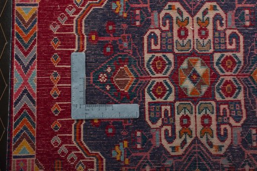 Backside of handmade 2000s Shiraz rug showing knot structure and weave density