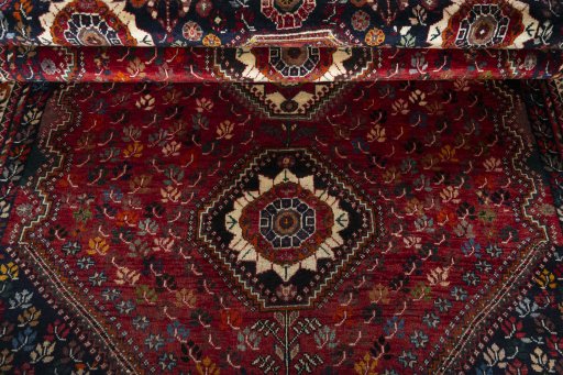 Full view of 1970s Shiraz rug from Iran / Persia, 283 × 180 cm in Red tones