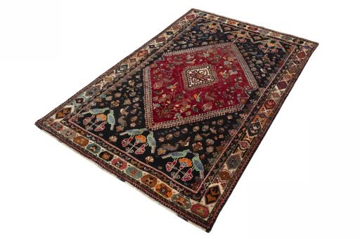 Corner detail of 2000s Shiraz rug showing border pattern and Wool pile