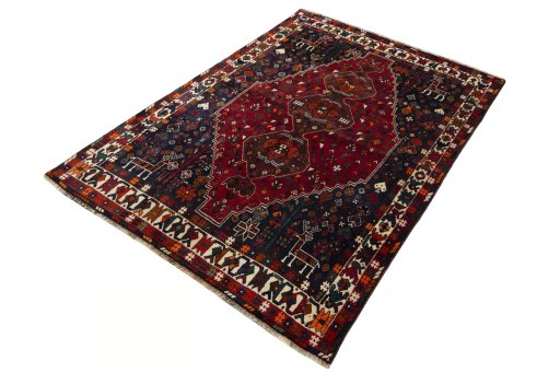 Corner detail of 2000s Shiraz rug showing border pattern and Wool pile