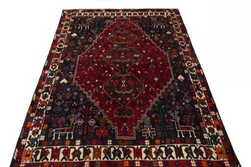 Surface texture of 2000s Shiraz rug with natural Wool and intricate pattern