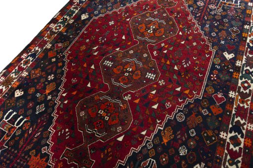 Backside of handmade 2000s Shiraz rug showing knot structure and weave density