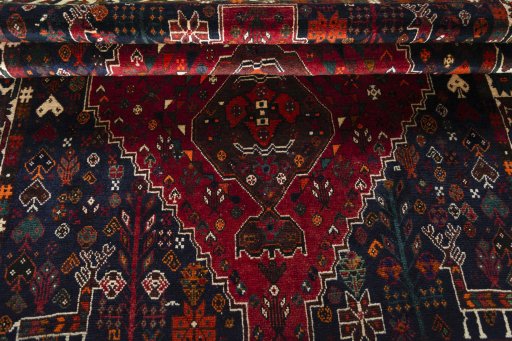 Full view of 2000s Shiraz rug from Iran / Persia, 249 × 174 cm in Red tones