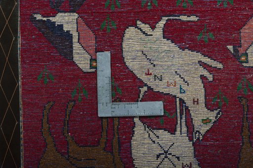 Backside of handmade 2000s Shiraz rug showing knot structure and weave density