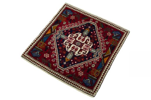 Corner detail of 2000s Shiraz rug showing border pattern and Wool pile