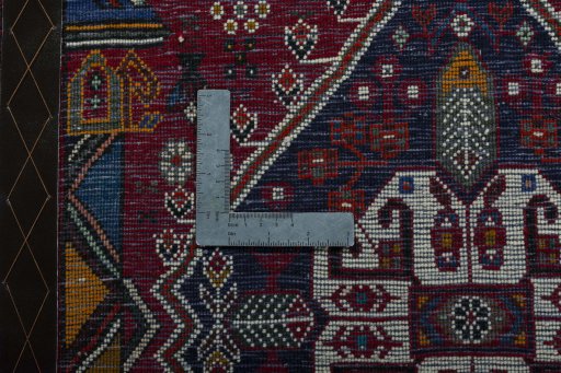 Backside of handmade 2000s Shiraz rug showing knot structure and weave density