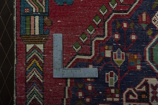 Backside of handmade 2000s Shiraz rug showing knot structure and weave density